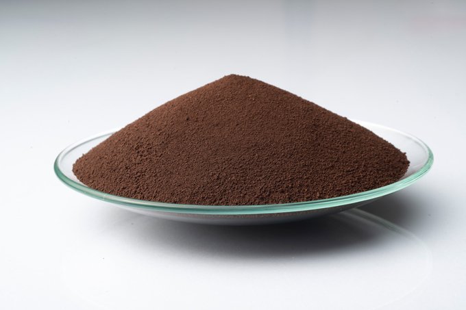 LANXESS Iron Oxide Brown 4610 pigment in a glass dish.